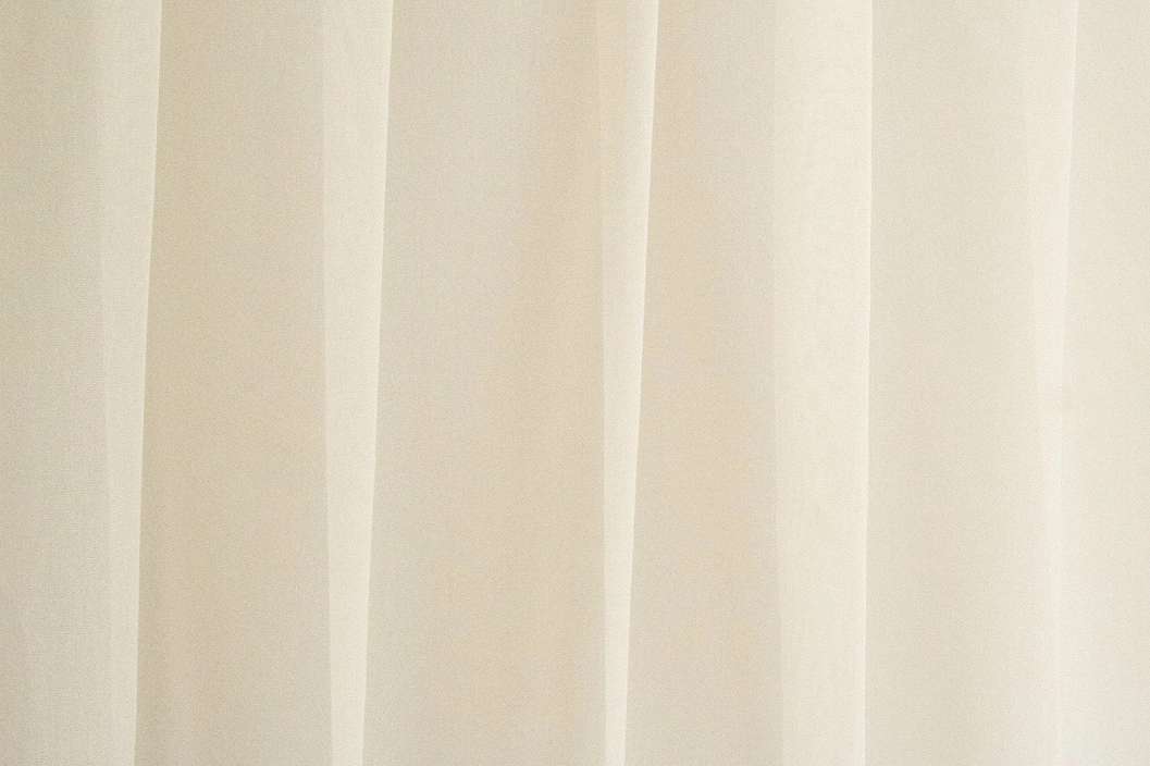 Fényáteresztő függöny textil enyhe beige színben