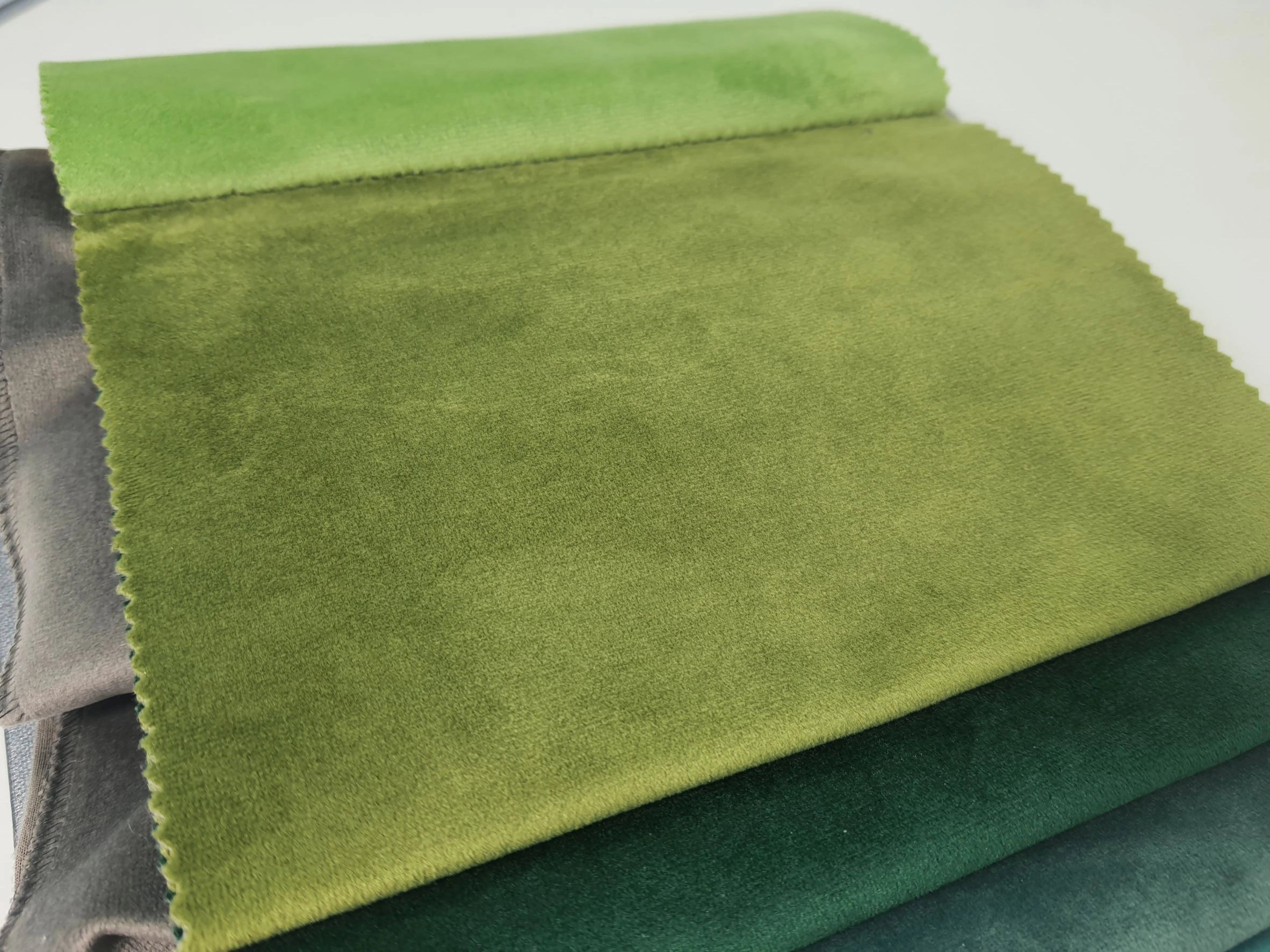 Pisztácia zöld sötétítő függöny anyag 150cm széles matt felületű